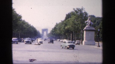 1957: a main city road and more vehicles are moving at the morning time and not