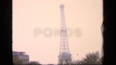 1957: view of eiffel tower of the past possibly filmed from the river seine