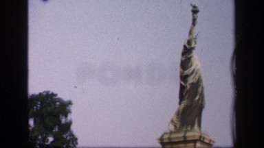 1957: statue of liberty replica stands over ramp of arched city overpass FRANCE