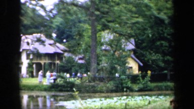 1957: shoreline view of people and homes along the water FRANCE