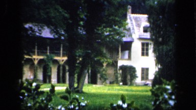 1957: country house has extension of terraced upper floor over archways FRANCE