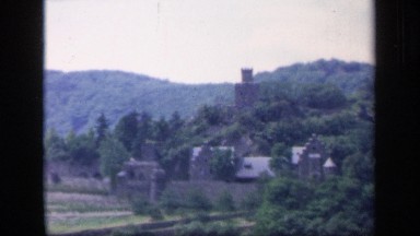 1957: Panoramic Hillside View with Buildings and Trees in Ireland