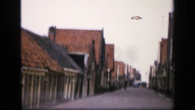 1957: Travelling Down Small Street with Pitched Red Tile Roofs Netherlands