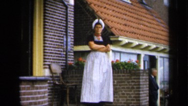 1957: Dutch Woman Waiting at Front of Building Netherlands