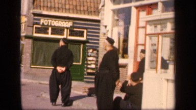 1957: the view of a city where people use cycling and walking methods.