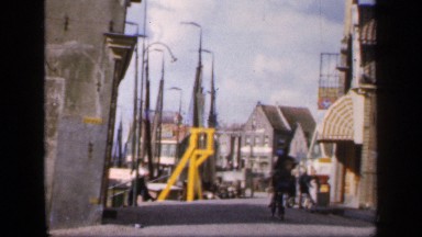 1957: Group of Girls Dancing in the Road, People Riding Cycle, Woman Walking