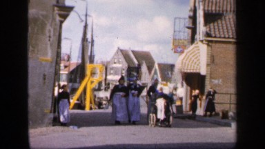 1957: Ladies Walking on Road with Woman in Wheelchair