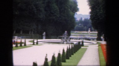 1957: a cute garden with small grass with decoration and a small pool center of