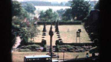 1957: A Scenic View of a Castle with Gardens and Interesting Architectural Features