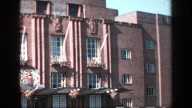1957: panoramic view of a brick building with a blue sky background ENGLAND
