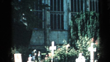 1957: A Church in England with Trees and Grass in Front