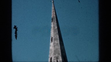 1957: a large building with a big point at the top is shown from top to halfway