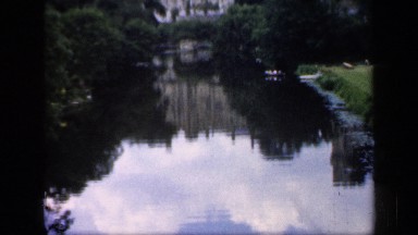 1957: Lake Has Muted Reflection of Majestic Castle, Tower and Lush Grounds