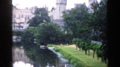 1957: the old city has a castle with towers and is build near a river. ENGLAND