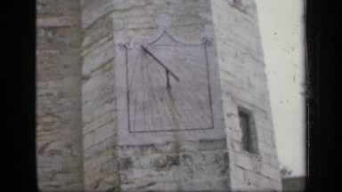 1957: daytime at a castle a sun clock can be seen on the castle main wall, side