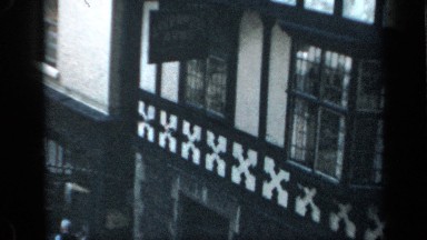 1957: a view of an old building on an ancient neighborhood downtown ENGLAND
