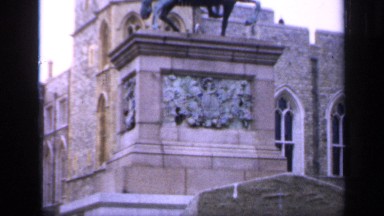 1957: a tremendous palace grounds with a statue near the front ENGLAND