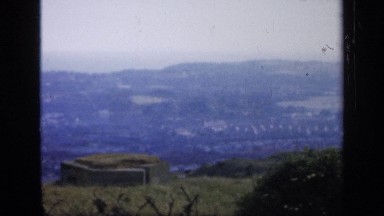1957: panoramic view of a town on the shore of the sea from the top of mountain