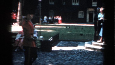 1957: british queen's guard marching by in bearskin hats as tourist and