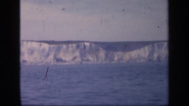 1957: a cute water flow that looks like river and a long stone at the other side