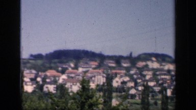 1957: an antiquated village lined with trees. ENGLAND