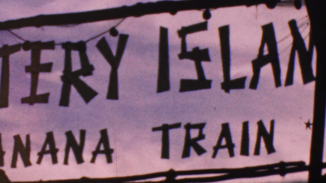 Mystery Island and Banana Train sign with bold dark letters and hanging trim.