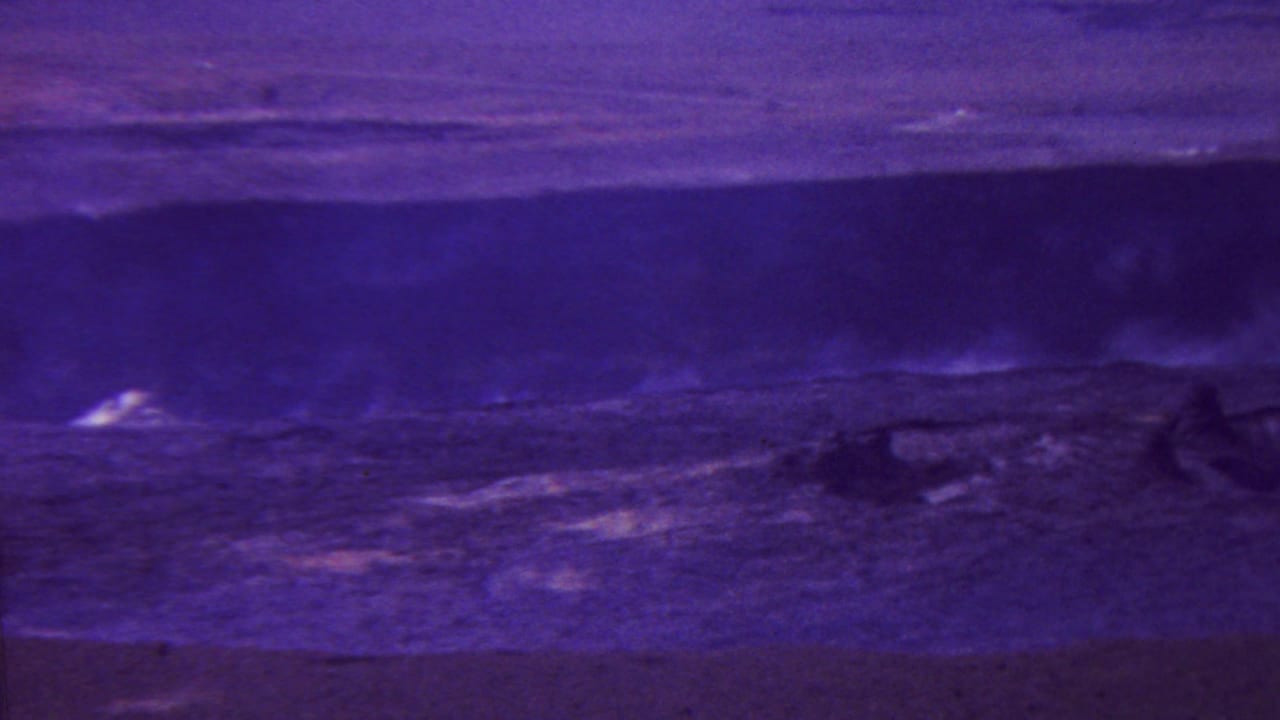 Dark violet landscape with a horizontal horizon and pale plumes across the middle distance.