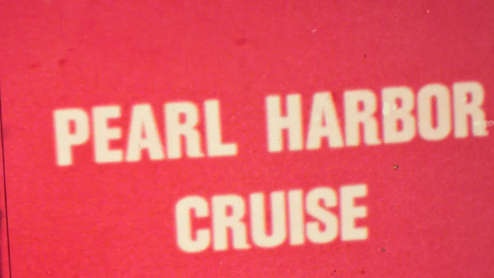 A red home-movie title card fills the frame with white block lettering reading Pearl Harbor Cruise, identifying the sightseeing segment.
