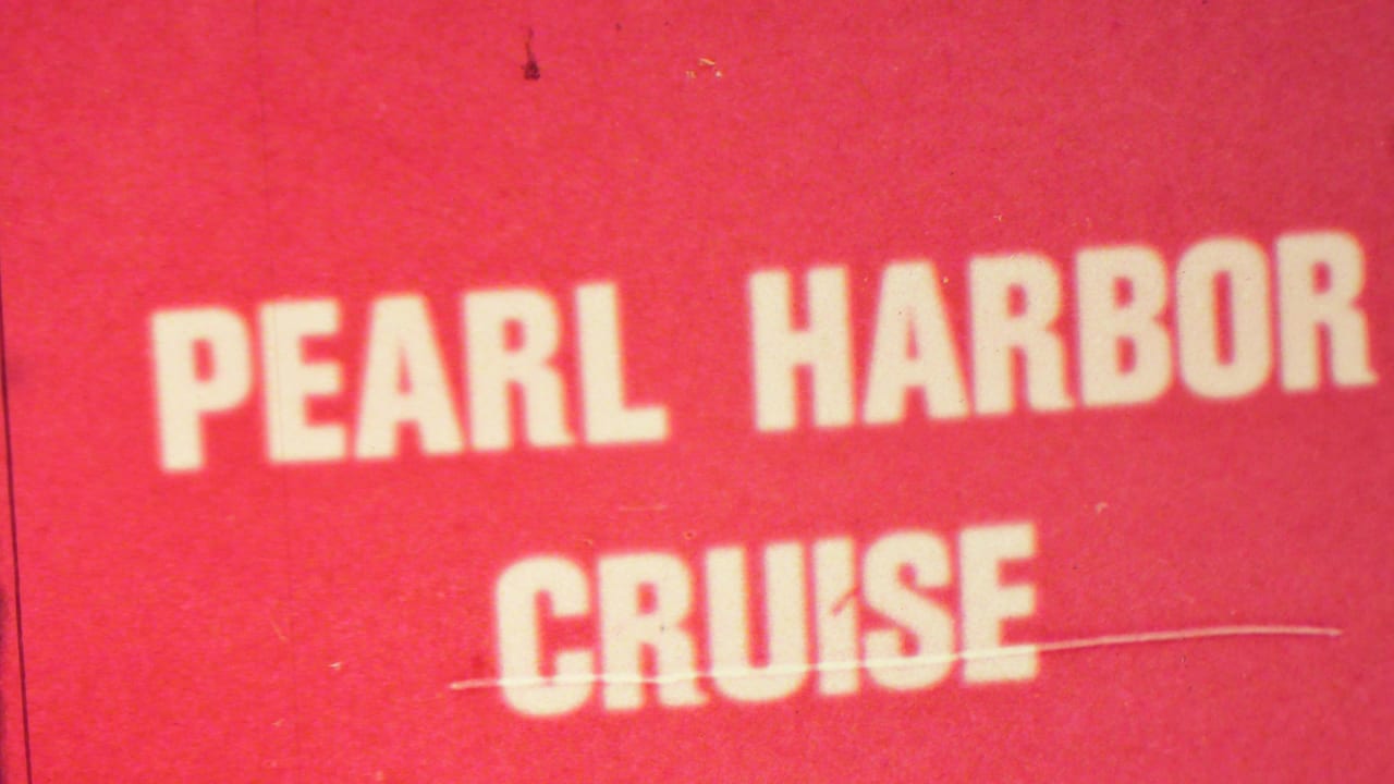 Pearl Harbor Cruise sign with red background and white lettering.