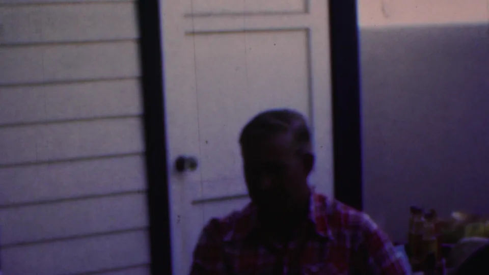 The final frame shows a darkly exposed older figure by a porch door and light exterior siding in the 1949 Seaside, New Jersey home-movie footage.