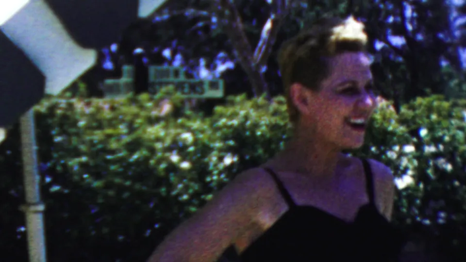 In the final frame, the woman turns while smiling in a black swimsuit, with hedges, trees, shade umbrella fabric, and an indistinct sign in the background.