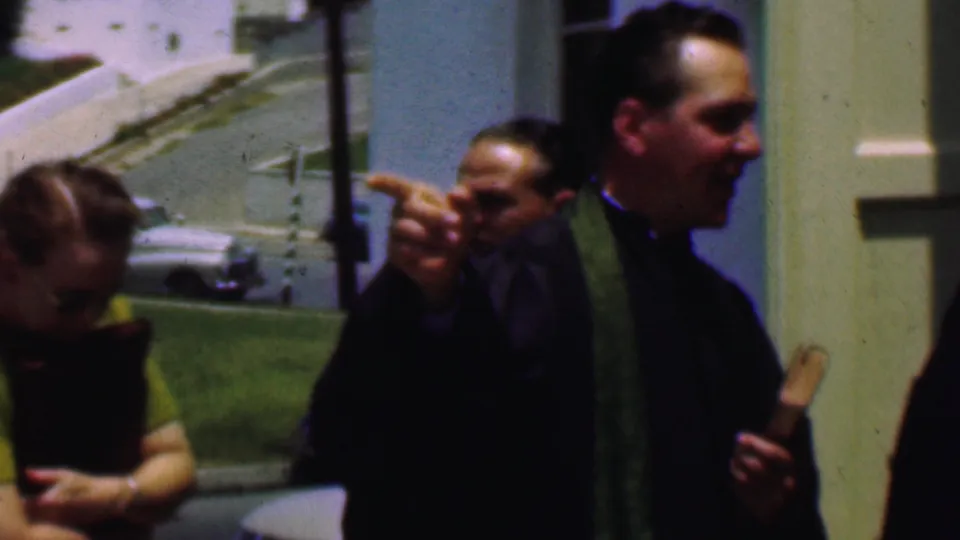 The 1956 Dallas church scene shows a clergyman gesturing with one hand while holding a book, with adults and parked cars visible around the entrance.