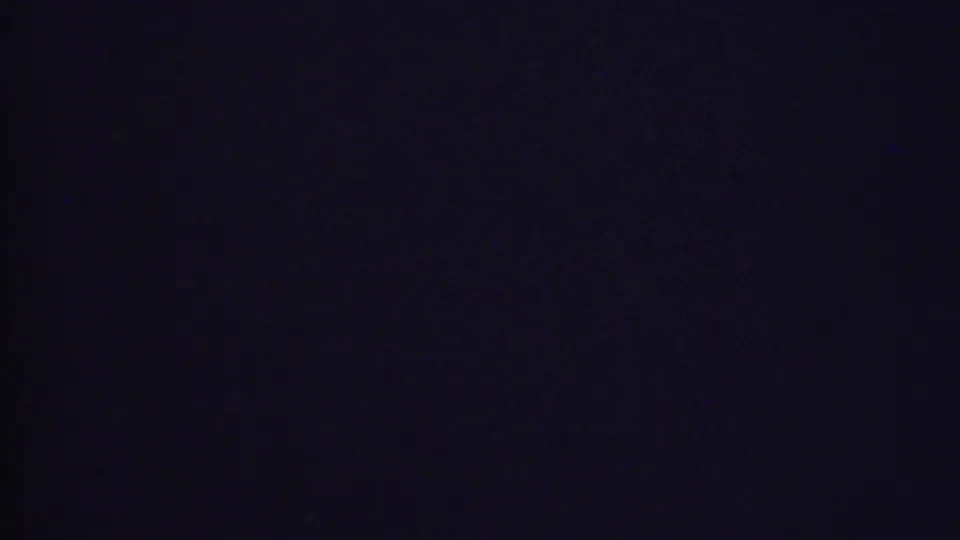 Dark final frame from a 1956 Phoenix domestic home movie, with the supplied metadata indicating holiday gifts and a patterned drum despite limited visibility in the contact sheet.