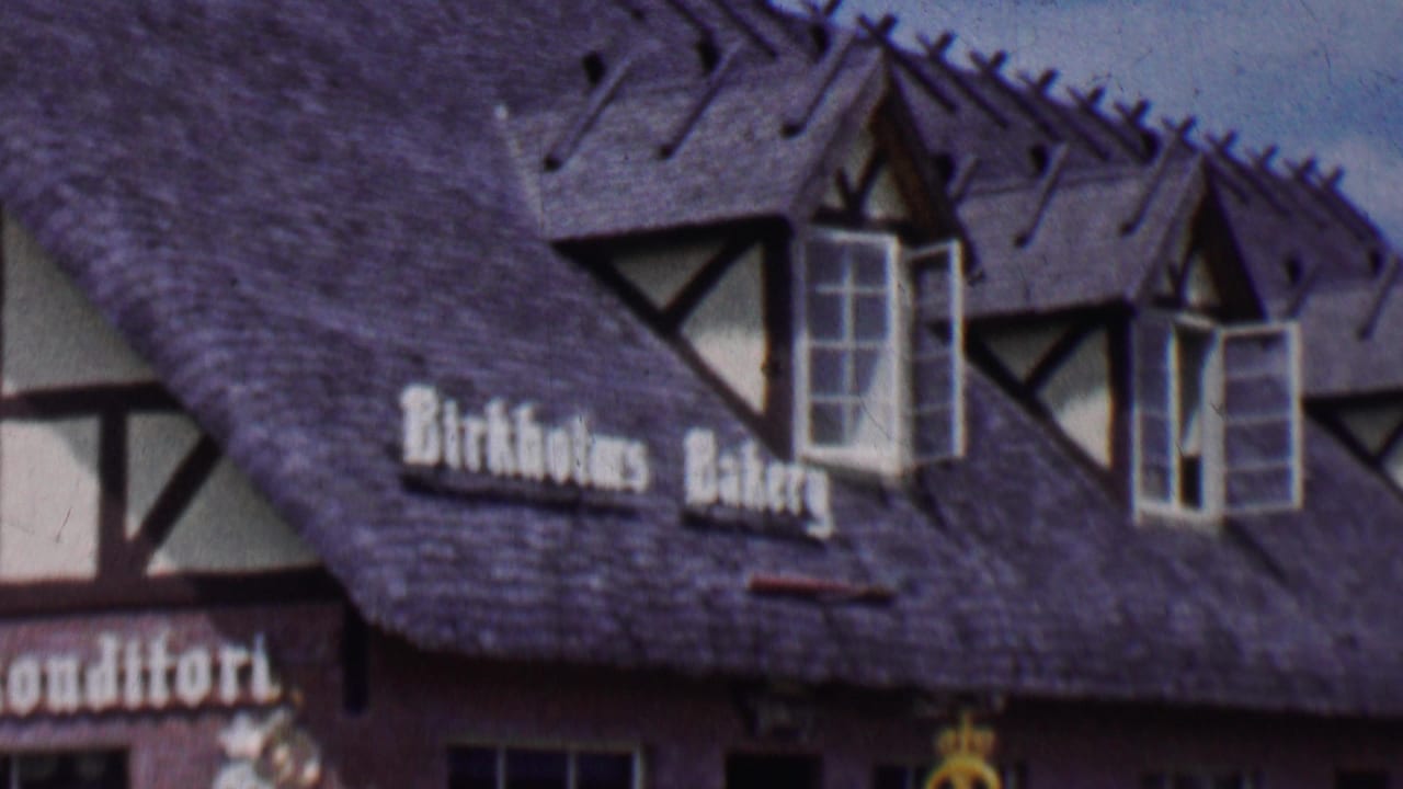Closer view of Birkholm's Bakery signage, dormer windows, and steep roofline.