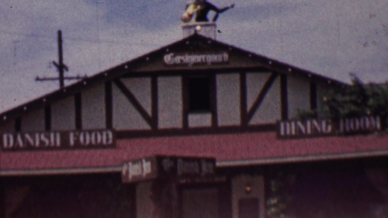 Close exterior view of the restaurant roofline and Danish Food signage.