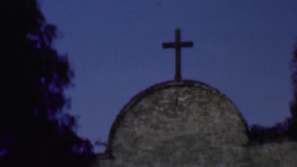 1961 San Diego 8mm still with the cross more centered over the church dome as the handheld camera tilts upward.