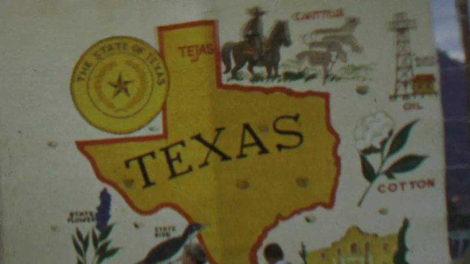 1967 8mm frame showing the Texas souvenir poster with map, seal, cowboy, cotton, and Alamo graphics, while partial heads of people appear at the bottom edge.