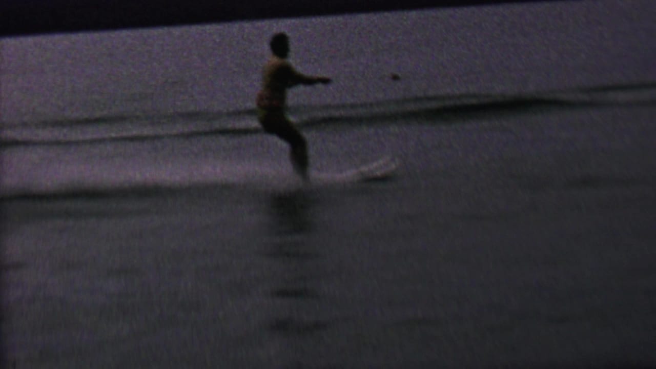 In 1962 home-movie footage identified as St. Paul, Minnesota, a woman appears to water ski behind a motorboat on a lake, with the tow rope stretching across the water.