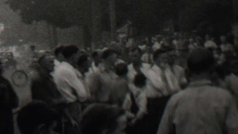 A wider view shows a dense crowd of mostly men observing smoke or fumes across an outdoor public area in 1937 Trenton, New Jersey metadata.