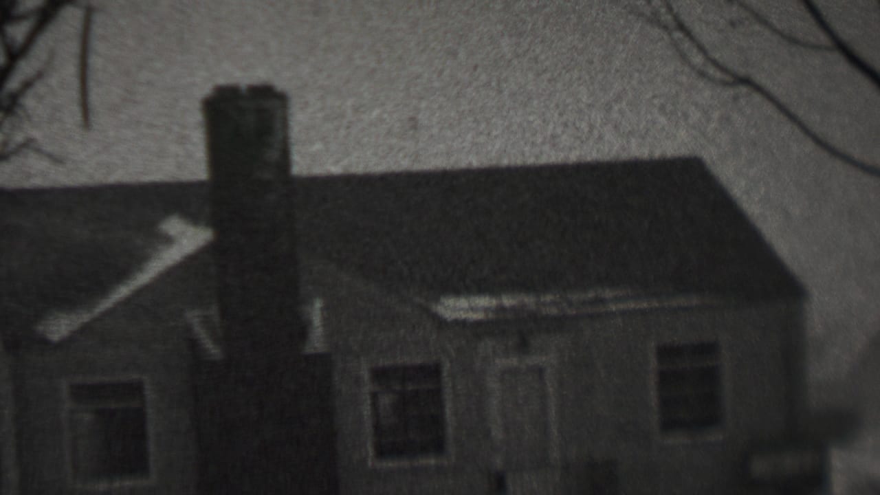 Black-and-white 8mm frame of a small residential house in snowy weather, consistent with the supplied 1937 Trenton, New Jersey metadata.