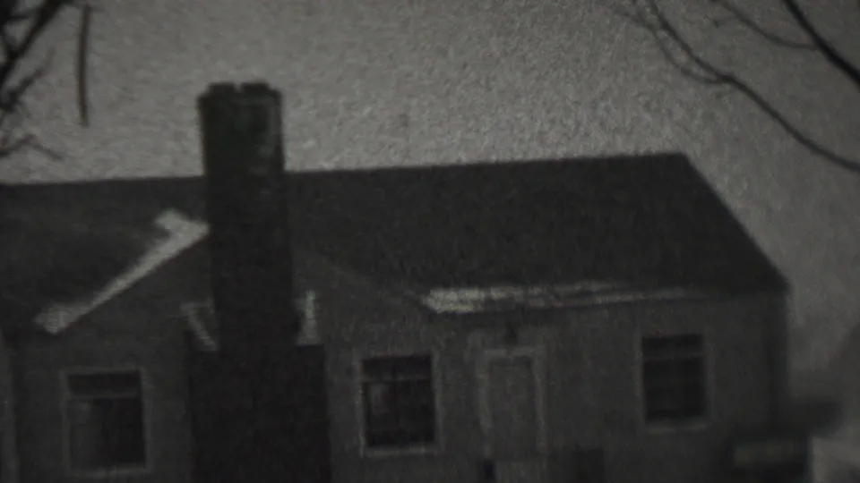 Black-and-white 8mm frame of a small residential house in snowy weather, consistent with the supplied 1937 Trenton, New Jersey metadata.
