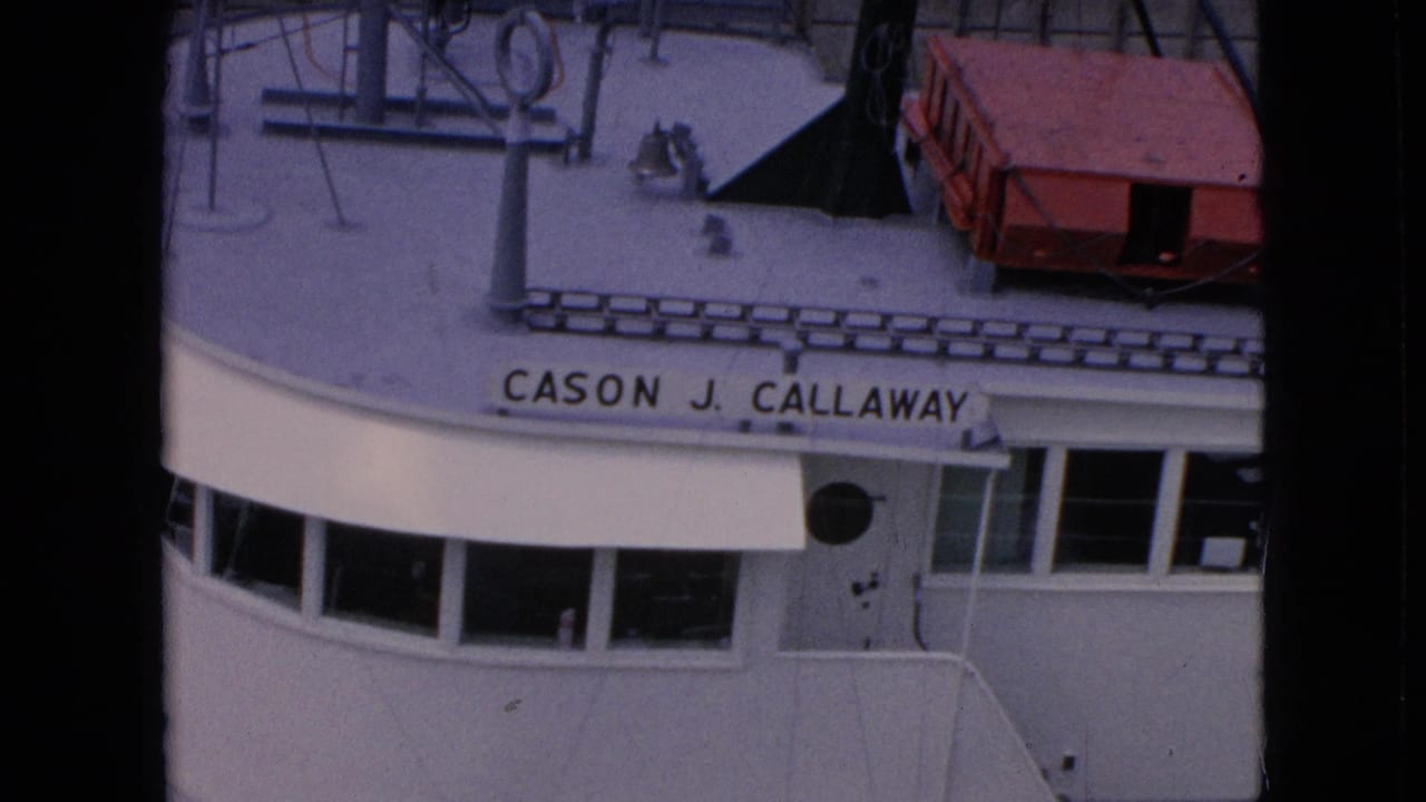 1964 8mm overhead view of the Cason J. Callaway ship superstructure in the supplied Niagara Falls, New York canal footage, with bridge windows and deck equipment visible.