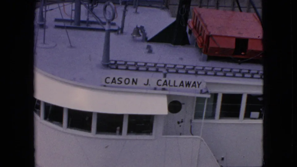 1964 8mm overhead view of the Cason J. Callaway ship superstructure in the supplied Niagara Falls, New York canal footage, with bridge windows and deck equipment visible.