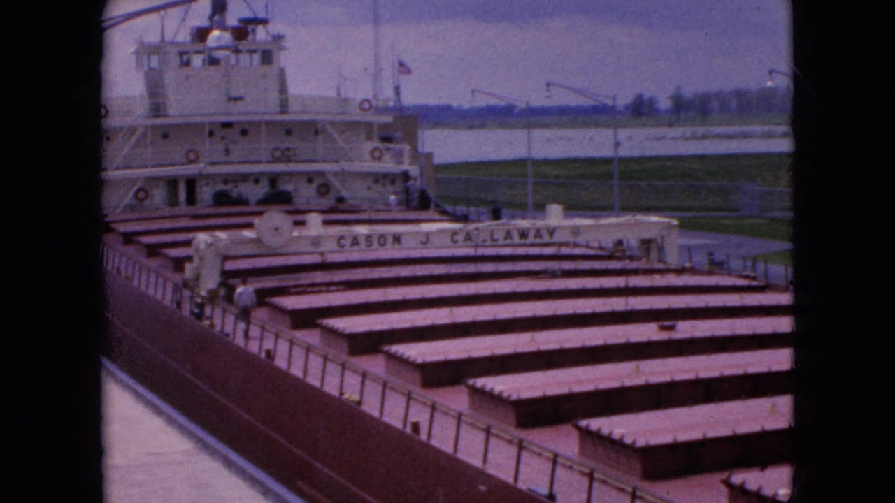 Docked cargo ship with the name Cason J. Callaway visible across the stern area and cargo hatches in view.