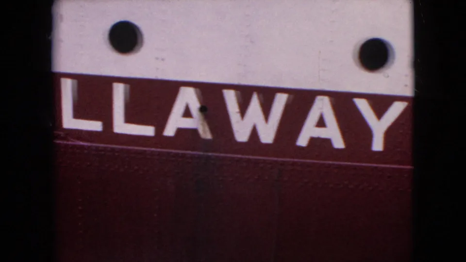 1964 8mm frame showing the vessel's red side band with large white Callaway lettering, white upper hull, and round black portholes.