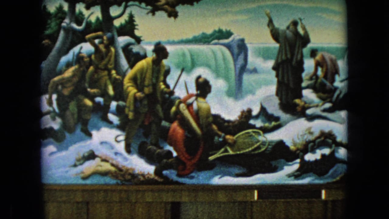 Snowy diorama with explorers and a raised-arm figure near a waterfall.
