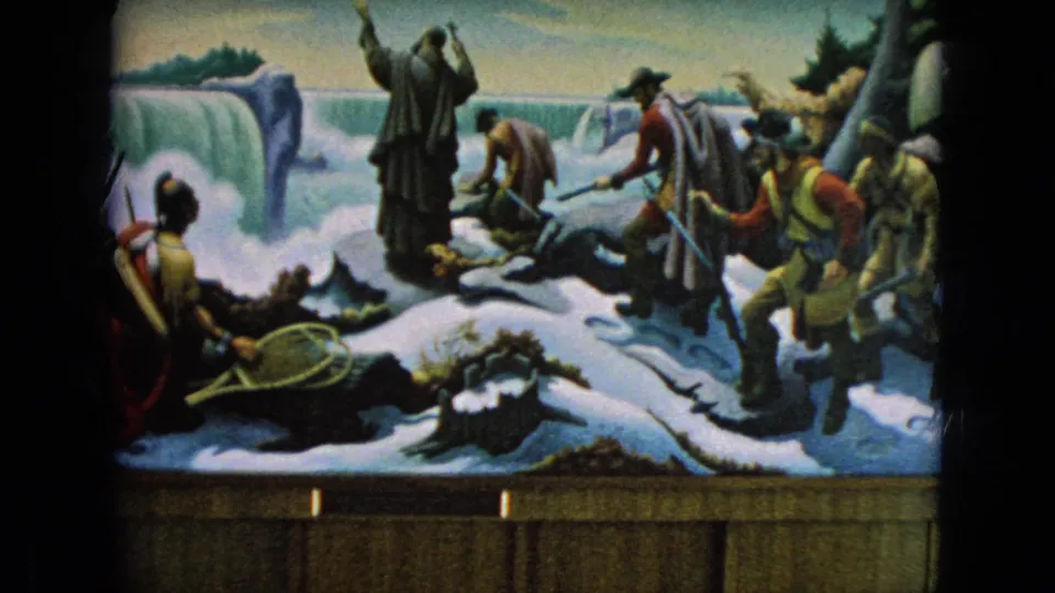 The mural display fills the frame, with painted Native American and settler figures in winter clothing beside icy terrain, waterfall imagery, and a partial covered wagon at the right.