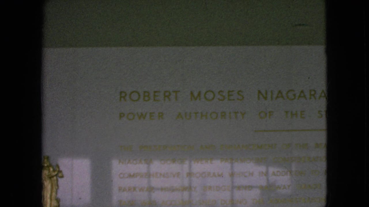 Close view of a public plaque reading in part Robert Moses Niagara, with Power Authority of the State of New York text partly visible.