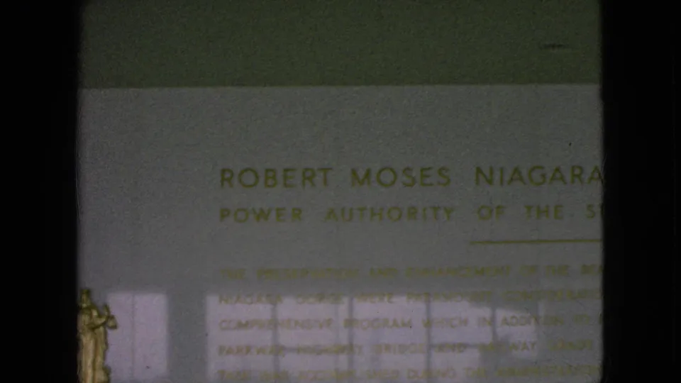 Close view of a public plaque reading in part Robert Moses Niagara, with Power Authority of the State of New York text partly visible.