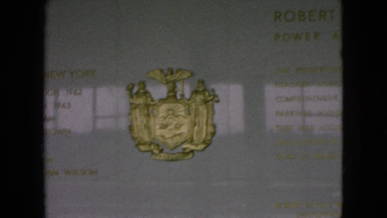 1964 Niagara Falls, New York frame with the gold New York State coat of arms centered near faint Robert Moses Power Authority wording and reflected window shapes.